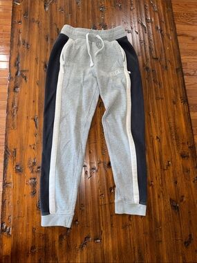 Nike Kids Grey Joggers with Black Side Panels and White Stripes